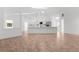 Spacious open floor plan and kitchen with modern island and new stainless steel appliances at 19723 Midway Blvd, Port Charlotte, FL 33948