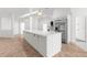 An open concept kitchen with updated appliances, marble countertops and tiled floors at 19723 Midway Blvd, Port Charlotte, FL 33948