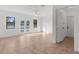 Living room with tile floors, ceiling fan, and glass doors to outside at 19723 Midway Blvd, Port Charlotte, FL 33948