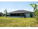 View of the spacious backyard with a screened in lanai; great for enjoying the outdoors at 2271 Alton Rd, Port Charlotte, FL 33952
