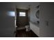 Bathroom with step-in shower, vanity and round mirror at 2271 Alton Rd, Port Charlotte, FL 33952