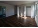 A sunlit bedroom featuring hardwood floors, white walls, and closet space at 2271 Alton Rd, Port Charlotte, FL 33952