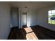 Bright bedroom with closet, window, and hardwood floors at 2271 Alton Rd, Port Charlotte, FL 33952