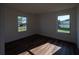 Bedroom with hardwood floors and windows showing the outdoors at 2271 Alton Rd, Port Charlotte, FL 33952