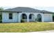 Beautiful single-story home featuring a well-manicured lawn and an attached one car garage at 2271 Alton Rd, Port Charlotte, FL 33952