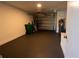 Garage with garage door, water heater, and storage space at 2271 Alton Rd, Port Charlotte, FL 33952