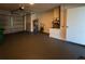 Garage with garage door, water heater, and storage space at 2271 Alton Rd, Port Charlotte, FL 33952