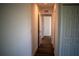 A bright hallway featuring wood floors and white walls at 2271 Alton Rd, Port Charlotte, FL 33952