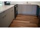 Stylish kitchen with gray cabinets, stainless steel appliances, and wood-look floors at 2271 Alton Rd, Port Charlotte, FL 33952