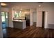 Inviting living space flows into an open kitchen with stainless appliances and a breakfast bar at 2271 Alton Rd, Port Charlotte, FL 33952