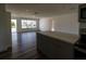 Bright open-concept living room with hardwood floors and a view of the outdoors at 2271 Alton Rd, Port Charlotte, FL 33952