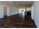 Spacious living room with hardwood floors and sliders to the patio area at 2271 Alton Rd, Port Charlotte, FL 33952