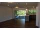 Open-concept living space featuring seamless integration of kitchen, living room, and screened lanai at 2271 Alton Rd, Port Charlotte, FL 33952
