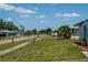 Charming street view highlighting a well-maintained neighborhood with manicured lawns at 2271 Alton Rd, Port Charlotte, FL 33952