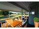 Staged screened in porch with view of yard and pond at 2271 Alton Rd, Port Charlotte, FL 33952