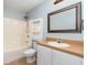 Bathroom featuring a shower-tub combo with tile surround, and a white vanity at 2420 Linton Ln, Port Charlotte, FL 33952