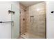 Bathroom showcasing a walk-in shower with a glass door, and tile backsplash with inset at 2420 Linton Ln, Port Charlotte, FL 33952