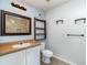 Bathroom with a shower, tile floors, and ample storage with an added hanging ladder at 2420 Linton Ln, Port Charlotte, FL 33952