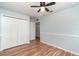 Bedroom boasting wood-look floors, large closets, and two points of egress at 2420 Linton Ln, Port Charlotte, FL 33952