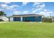 This home has a nice, green front lawn, and a single-car garage at 2420 Linton Ln, Port Charlotte, FL 33952