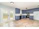 Spacious kitchen featuring updated appliances, a white countertop, and plenty of natural light at 2420 Linton Ln, Port Charlotte, FL 33952