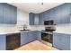 Well-lit kitchen with a black sink, updated appliances, and granite countertops at 2420 Linton Ln, Port Charlotte, FL 33952
