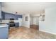Open-concept kitchen leading to the living area with a breakfast bar at 2420 Linton Ln, Port Charlotte, FL 33952