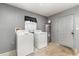 Laundry room featuring a washer, dryer, and a utilitarian aesthetic at 2420 Linton Ln, Port Charlotte, FL 33952