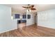 Spacious living room featuring hardwood floors with an open layout to the kitchen at 2420 Linton Ln, Port Charlotte, FL 33952