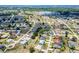 A beautiful aerial view of a residential neighborhood with lakes, mature trees, and nicely landscaped yards at 25379 Paladin Ln, Punta Gorda, FL 33983