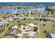Aerial view of a lakeside community and beautiful homes with green landscaping at 25379 Paladin Ln, Punta Gorda, FL 33983