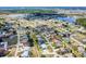 An aerial view of a planned residential community featuring mature landscaping, bodies of water, and well-maintained roadways at 25379 Paladin Ln, Punta Gorda, FL 33983