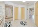 Large bathroom with a tub, shower, double closets, and a double sink at 25379 Paladin Ln, Punta Gorda, FL 33983