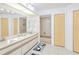 Bright Bathroom with double sink vanity, large mirrors, and multiple storage locations at 25379 Paladin Ln, Punta Gorda, FL 33983