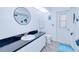 Bright bathroom with dark countertop, updated fixtures, and fun decor at 25379 Paladin Ln, Punta Gorda, FL 33983