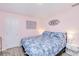 Comfortable bedroom features a soft bed, side tables, and modern artwork at 25379 Paladin Ln, Punta Gorda, FL 33983