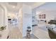 Bright and airy hallway leading to the living room and dining area, showcasing the open floor plan at 25379 Paladin Ln, Punta Gorda, FL 33983