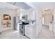 Well-equipped kitchen featuring modern appliances, white cabinetry, and an open layout at 25379 Paladin Ln, Punta Gorda, FL 33983