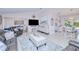 Spacious living room with contemporary design, large TV, and comfortable seating arrangement at 25379 Paladin Ln, Punta Gorda, FL 33983