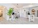 Bright office area with lots of natural light, modern furniture, and connection to the kitchen at 25379 Paladin Ln, Punta Gorda, FL 33983