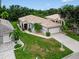 Lovely single-story home with a tile roof and verdant lawn in a pleasant neighborhood at 26111 Feathersound Dr, Punta Gorda, FL 33955