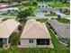 Beautiful aerial view of single-story home near a golf course and community lake at 26111 Feathersound Dr, Punta Gorda, FL 33955