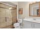 Bathroom featuring a glass enclosed shower, a toilet, and a vanity with mirror at 26111 Feathersound Dr, Punta Gorda, FL 33955