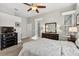 Bedroom with a ceiling fan, carpet, and decorative accents at 26111 Feathersound Dr, Punta Gorda, FL 33955