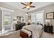 Bedroom with a ceiling fan, carpet, and decorative accents at 26111 Feathersound Dr, Punta Gorda, FL 33955