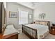 Comfortable bedroom with a ceiling fan, carpet, and decorative accents at 26111 Feathersound Dr, Punta Gorda, FL 33955