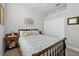 Bedroom with a ceiling fan, carpet, and closet with mirrored sliding doors at 26111 Feathersound Dr, Punta Gorda, FL 33955