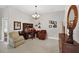 Comfortable home office with tile floors, neutral walls, and a traditional desk and chairs at 26111 Feathersound Dr, Punta Gorda, FL 33955