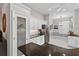 Spacious kitchen showcasing a pantry, stainless steel refrigerator, and granite countertops at 26111 Feathersound Dr, Punta Gorda, FL 33955