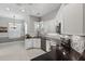 Bright and modern kitchen with granite counters, mosaic backsplash, and stainless steel appliances at 26111 Feathersound Dr, Punta Gorda, FL 33955